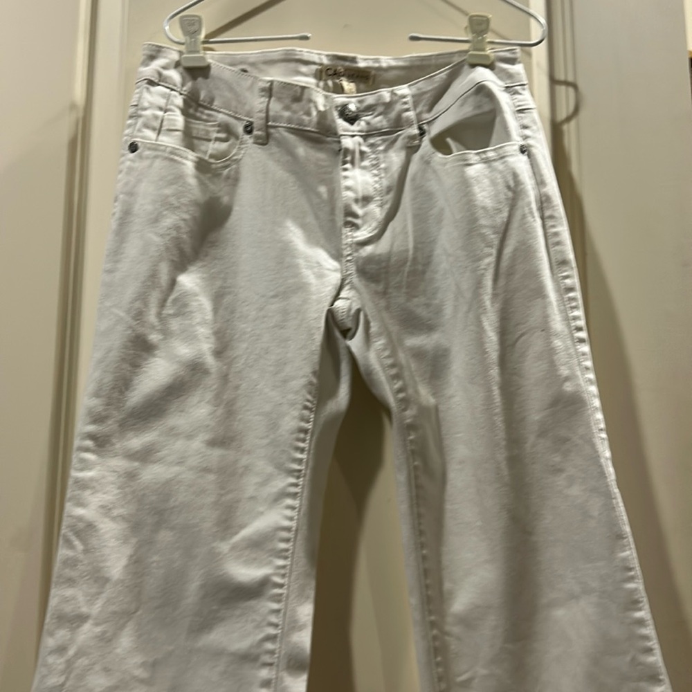 Like New! CAbi white flare denim jeans has stretch zip fly size 2